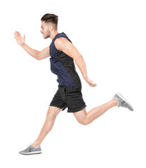 Wall Mural - Young man in sportswear running against white background