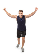 Wall Mural - Young man in sportswear running against white background