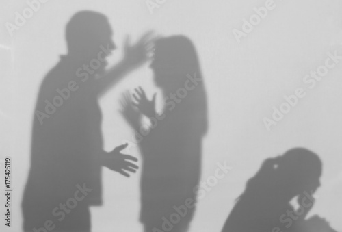 Fotografía Silhouettes of quarreling parents and little child on white background