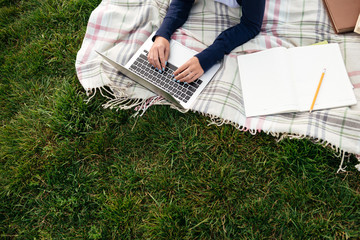 Canvas Print - Top view of a female student studying on laptop computer