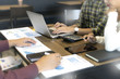 © sabthai - gGroup of business man and woman discussing on the table about startup business