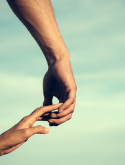 Two hands touching fingers on cloudy sky