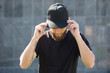 © 4Max - Hipster handsome male model with beard  wearing black blank  baseball cap  with space for your logo