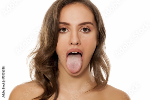 Fotografía young beautiful woman stick out her tongue