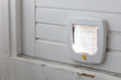 Inside view of a regular white cat flap, flap closed