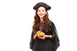 © Mediaphotos - Young woman in Halloween costume posing against white background in studio