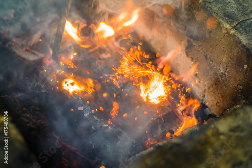 Fotografie, Obraz Hot sparking live-coals burning in a barbecue