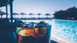 © Koki Jovanovic/Stocksy - Refreshing drink by the pool