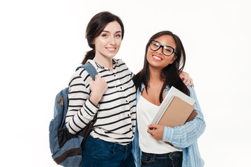 Poster - Couple of two smiling multiethnic female students with backpack