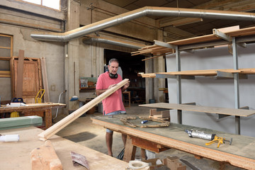 a carpenter working in his workshop