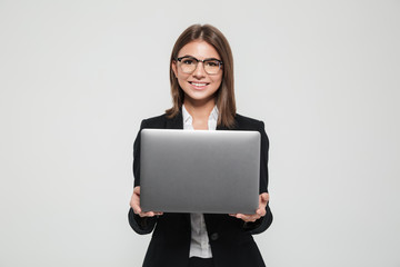 Canvas Print - Portrait of a young attractive businesswoman in suit