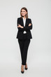 © Drobot Dean - Full length portrait of an attractive smiling businesswoman