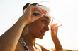 © Evgeny Lobanov - Closeup portrait of a young girl in white visor enjoying the sun