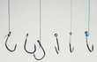 Many fishing hooks hang together.