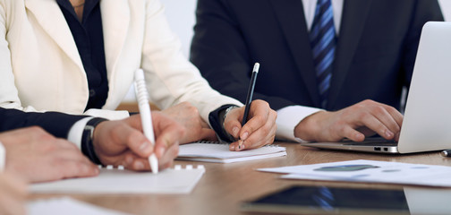 Group of business people or lawyers  at meeting, hands close-up