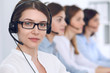 © rogerphoto - Call center operator.Young beautiful business woman in headset