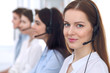 © rogerphoto - Call center operator.Young beautiful business woman in headset