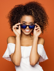 Beautiful black woman smiling and wear sunglasses