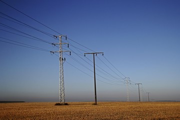 Electricity pylons at dawn, Upper Swabia, Baden-Wuerttemberg, Germany, Europe