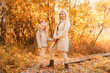 © viclin - Mom and daughter walk in autumn park
