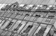 Abstrakte Fassade eines modernen Bürogebäudes,altes Wohngebäude gespiegelt, Wien,Österreich