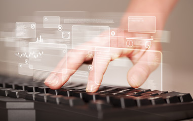 Hand touching keyboard with high tech buttons