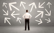 © ra2 studio - Confused salesman with arrows on wall