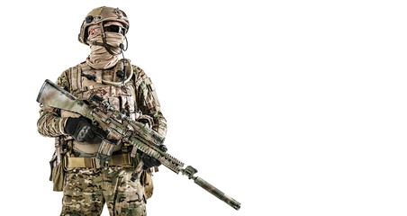 Half length low angle studio shot of special forces soldier in field uniforms with weapons, portrait isolated on white background. Protective goggles glasses are on