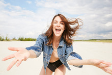 A Model Topless With Jeans Jacket In Happy "hey" Emotion On The Beach
