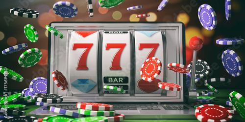 Fotografía Slot machine on a laptop screen and falling poker chips