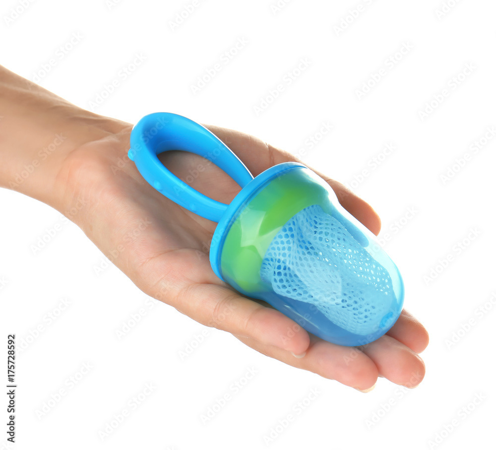 Woman holding baby's nibbler on white background