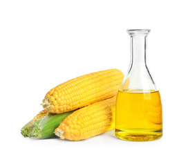 Sticker - Glass bottle with corn oil and ripe cobs on white background