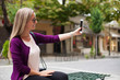 © Eightshot Images - Beautiful young woman taking selfie in the city