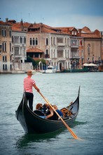 Gondola In Canal In Venice