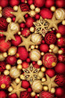 © marilyn barbone - Christmas gold and red bauble decorations forming an abstract background.