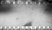 Grunge Scratched Dirty Film Strip Background With Blurred Effect.