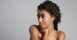 © Anastasia - happy serene young woman with beautiful olive skin and curly hair ideal skin and brown eyes