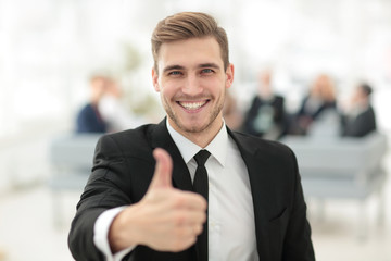 Poster - portrait of happy businessman showing thumb up.