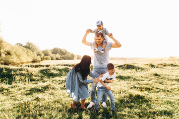 Family Dad Mom and Children in the Field