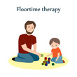 Little boy and a his father sitting on a floor and playing with blocks. Floortime therapy technique, used for teaching kids, especially for children with ASD or autism