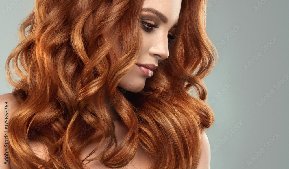 Beautiful model girl with long red curly hair .Red head . Care and beauty hair products   - obrazy, fototapety, plakaty 