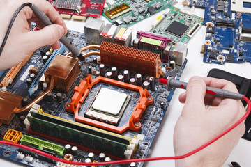 Poster - Engineer checking motherboard with multimeter