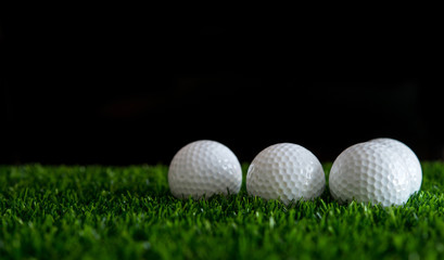 Wall Mural - golf ball on green grass