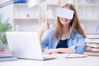 © Elnur - Young female student preparing for exams with VR glasses