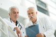 © auremar - two senior doctors talking together