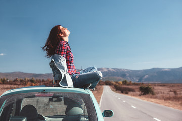 Girl enjoying road trip