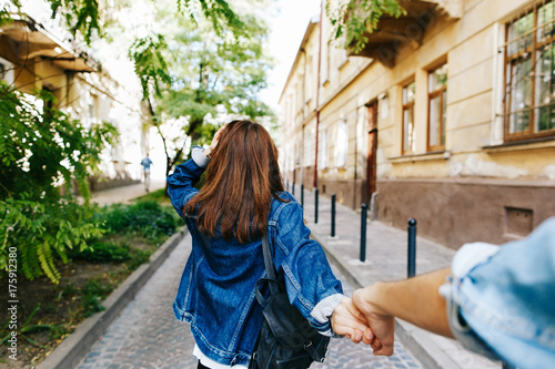 Look From Behind At Young Woman Holding Man S Hand In Follow Me Pose Buy This Stock Photo And Explore Similar Images At Adobe Stock Adobe Stock
