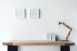 © LIGHTFIELD STUDIOS - photo frames hanging on wall at workplace
