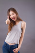 exited woman giving thumb up studio isolated portrait
