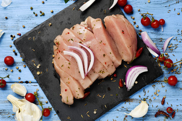 Wall Mural - spiced raw slices of turkey breast